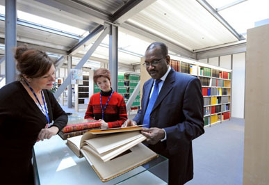 Click to enlarge photo: ITU Secretary-General consulting historical documents.
