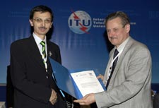 Director of the RB, Dr Valery Timofeev receiving his letter of appointment from the Conference Chairman, Tanju ataltepe
