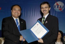 Deputy Secretary-General elect, Mr Houlin Zhao  receiving his letter of appointment from the Conference Chairman, Tanju ataltepe
