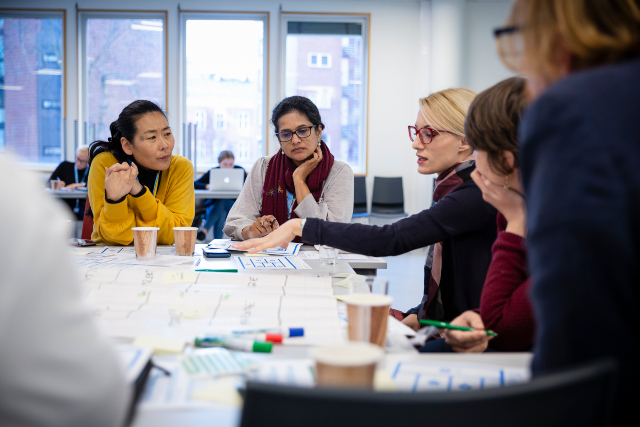 A group of international female stakeholders co-creating together