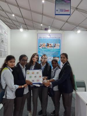 Care givers and girls in ICT with  Assistive Device for helping Disabled children.