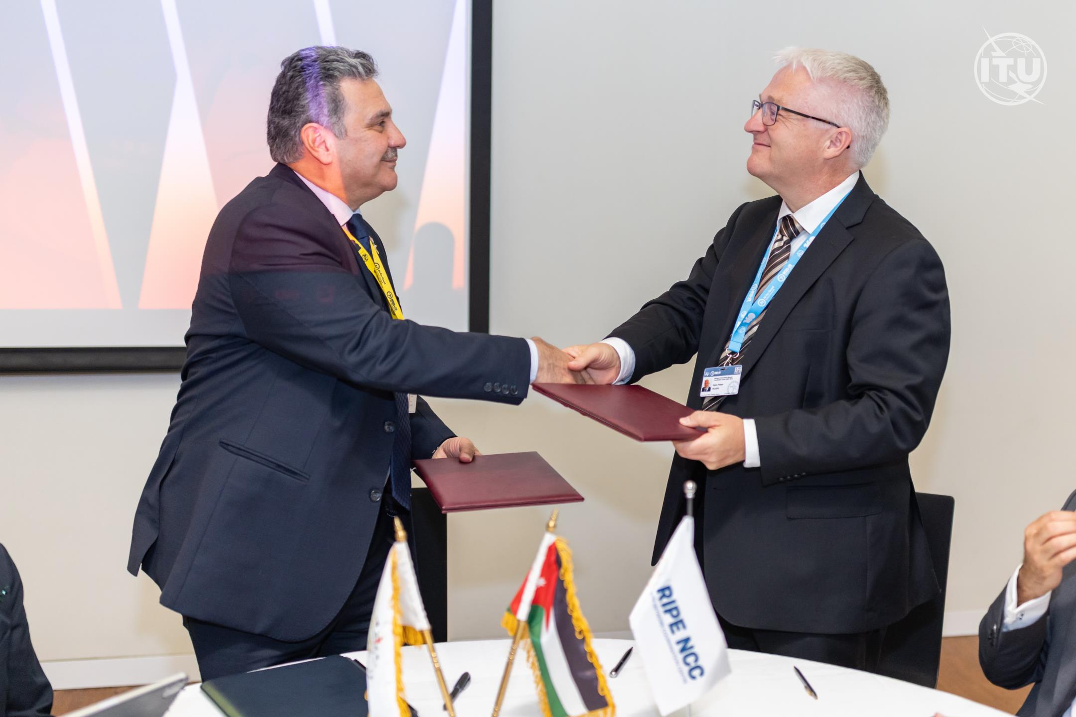 Eng. Bassam Al-Sarhan, President and CEO of Jordan’s TRC, and Mr. Hans Petter Holen, CEO of the RIPE NCC, sign a landmark MoU at WSIS+20,