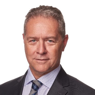 Tonko Obuljen, white male with grey hair, wearing a dark suit and grey tie.